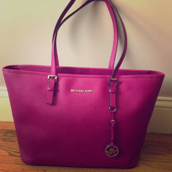 Michael Kors Handbags - large fuchsia MK jet set bag